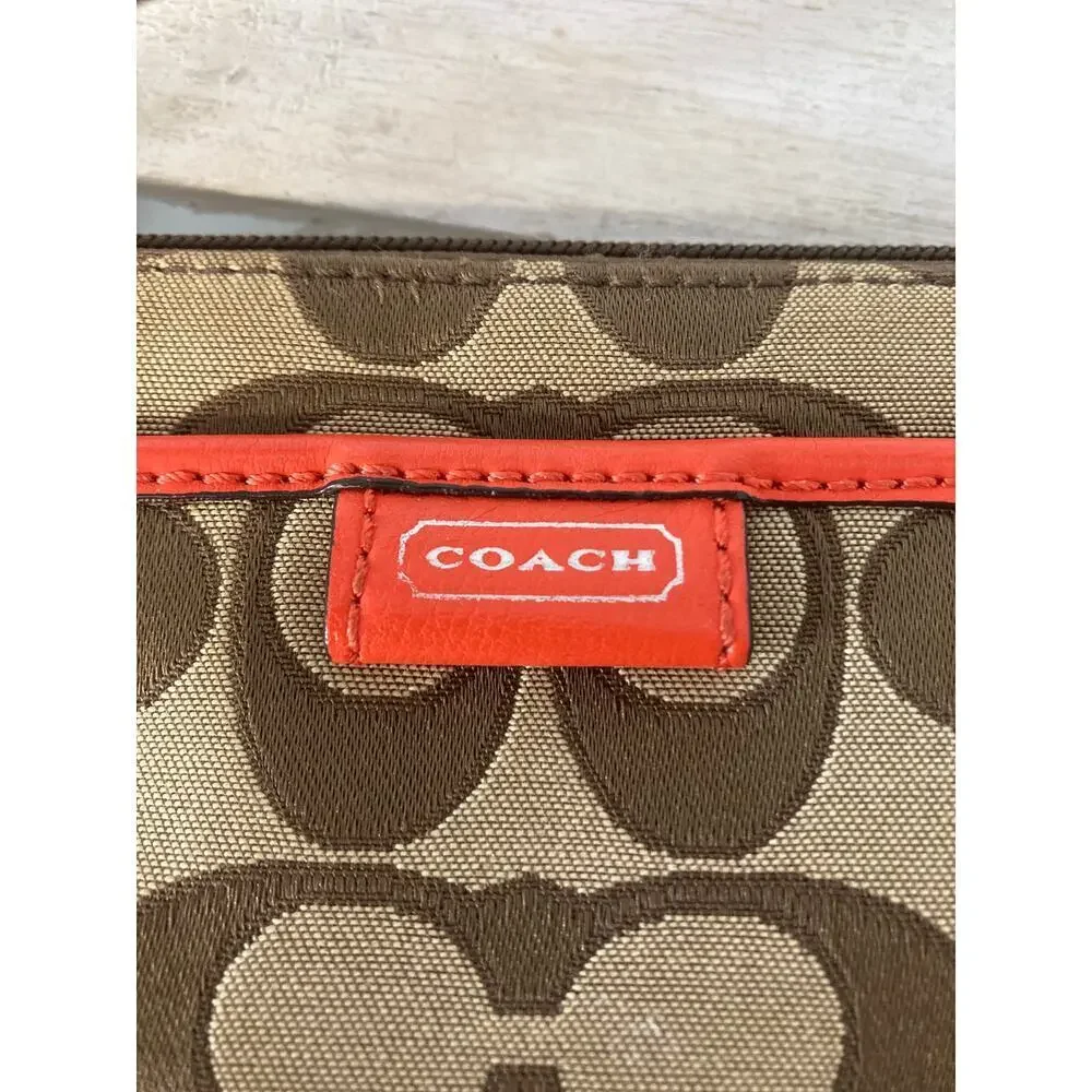 COACH SMALL SIGNATURE PRINT CANVAS, ORANGE TRIM WRISTLET.